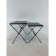 Modernist nesting tables in metal and black glass, 1950s.