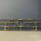 Architectural brutalist wall mounted sculpture made from cast metal.