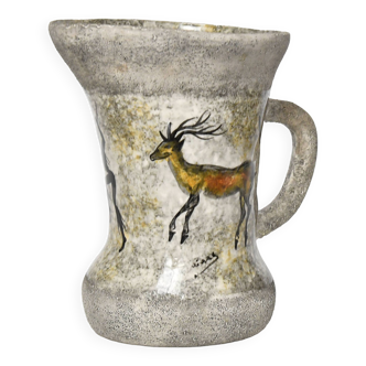 Vintage enameled stoneware pitcher decorated in the style of cave paintings