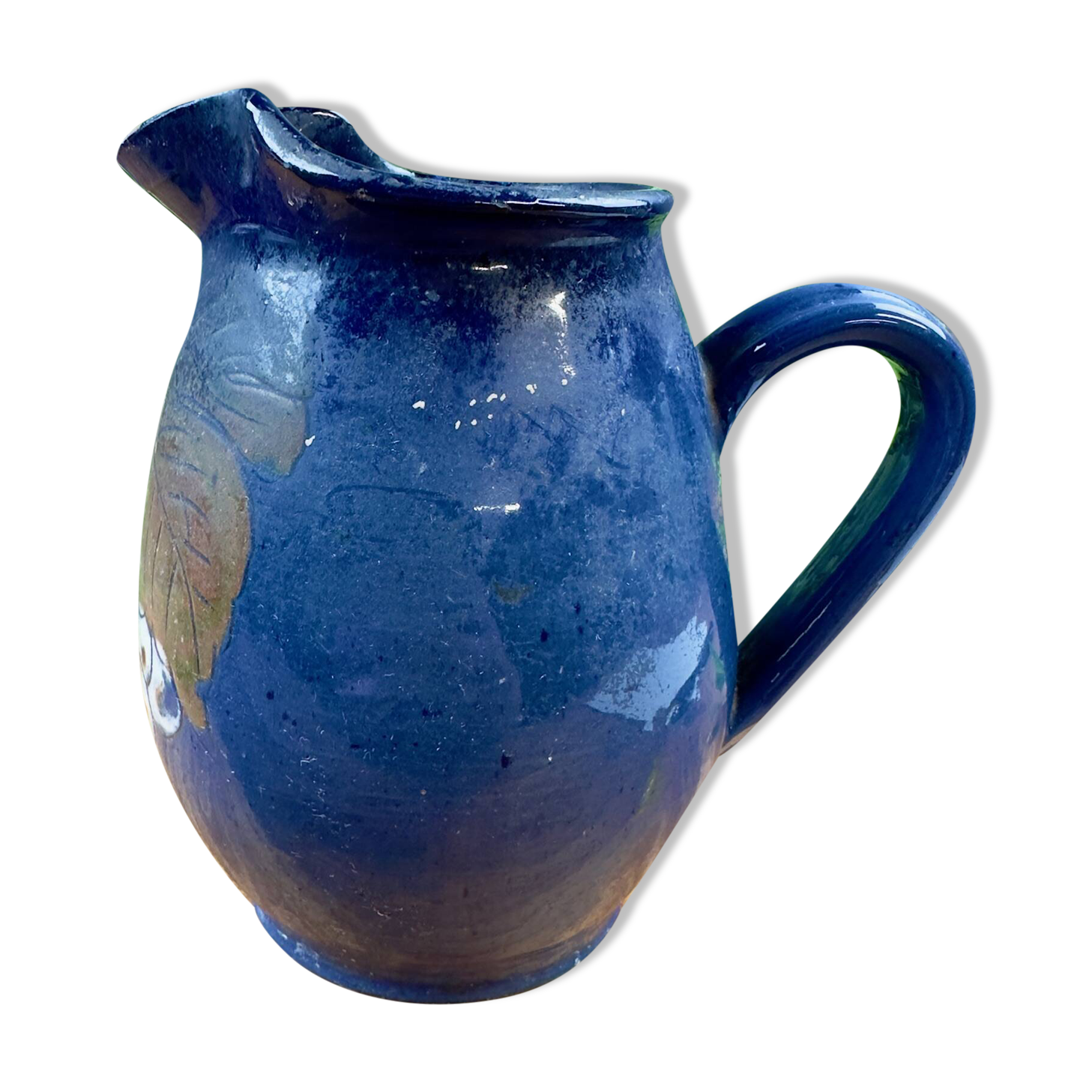 Blue ceramic pitcher with vintage artisan inscription decoration.