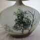 Glazed ceramic ball lamp signed Bossis with a fabric shade.