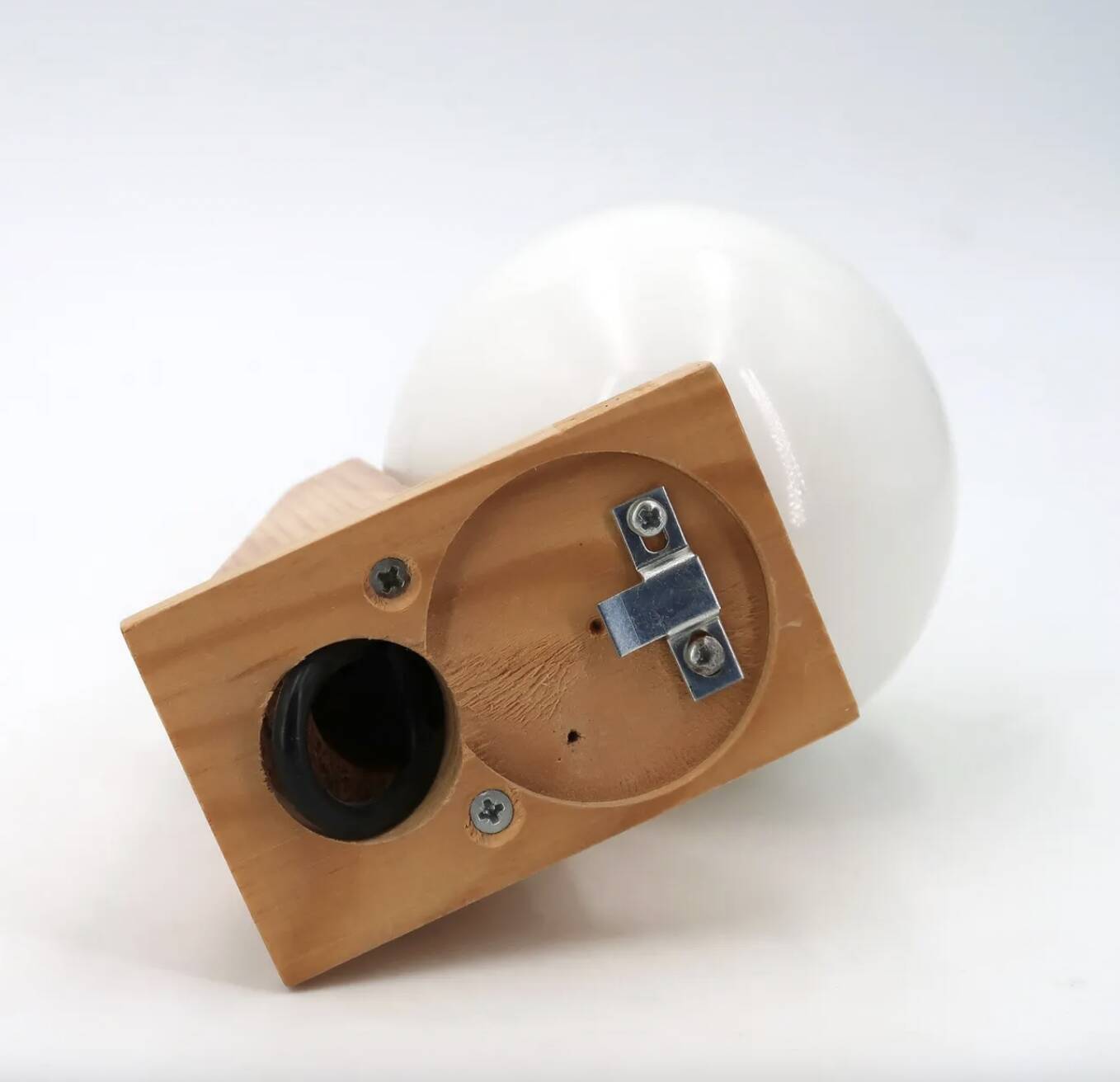 Pine wood wall light with opaque white glass globe, 1980s.