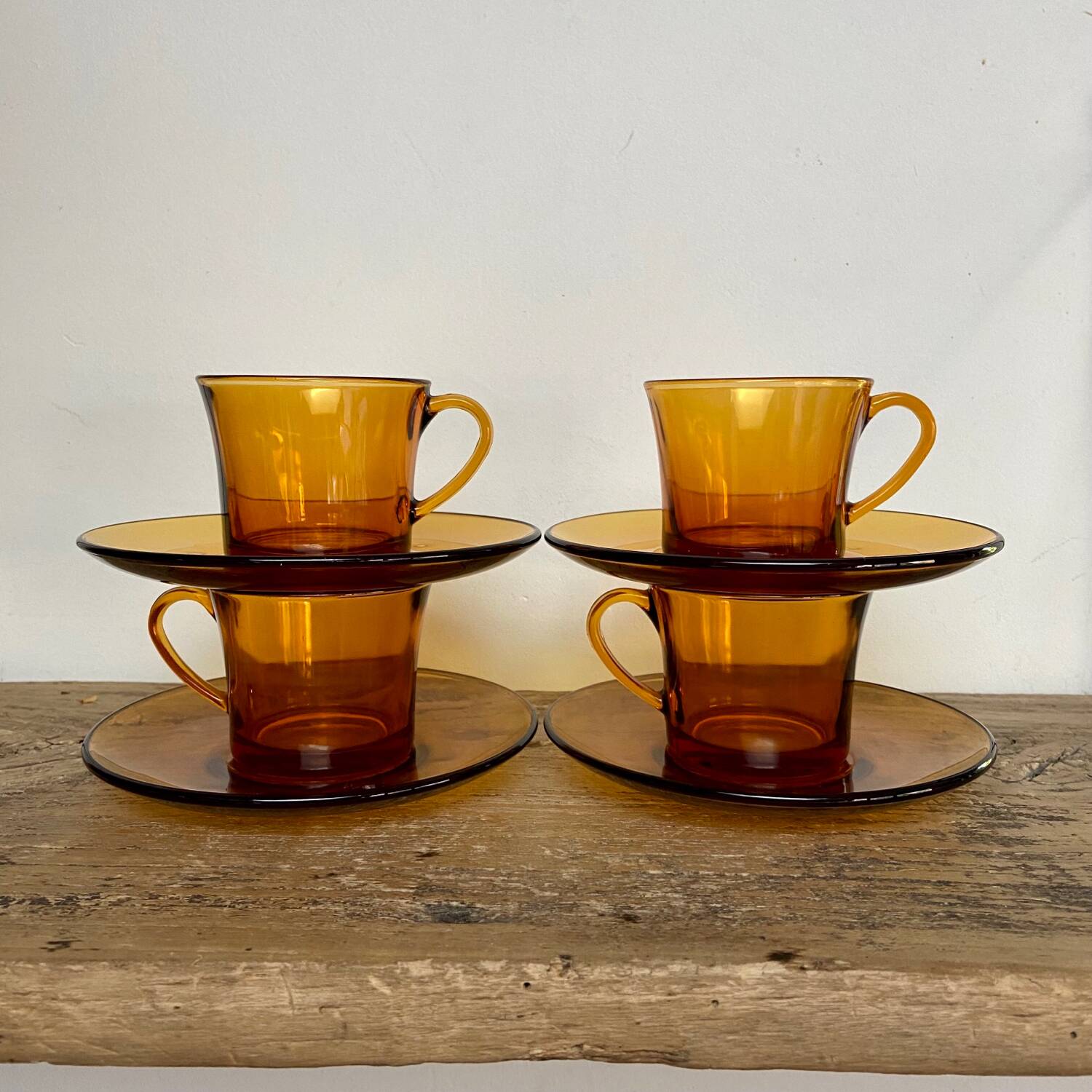4 amber Duralex cups and saucers