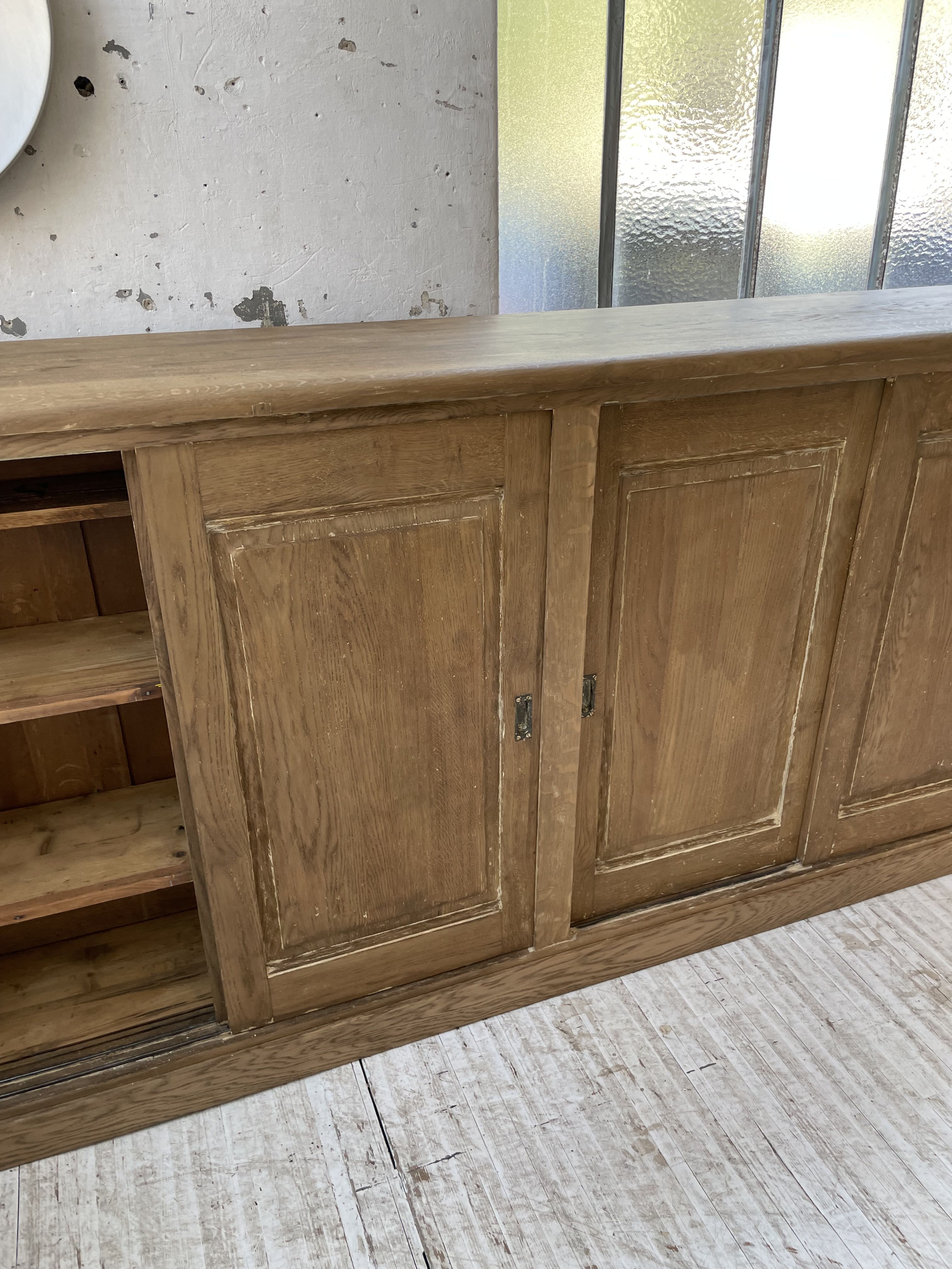 Large row of solid oak loom sliding doors