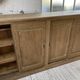 Large row of solid oak loom sliding doors