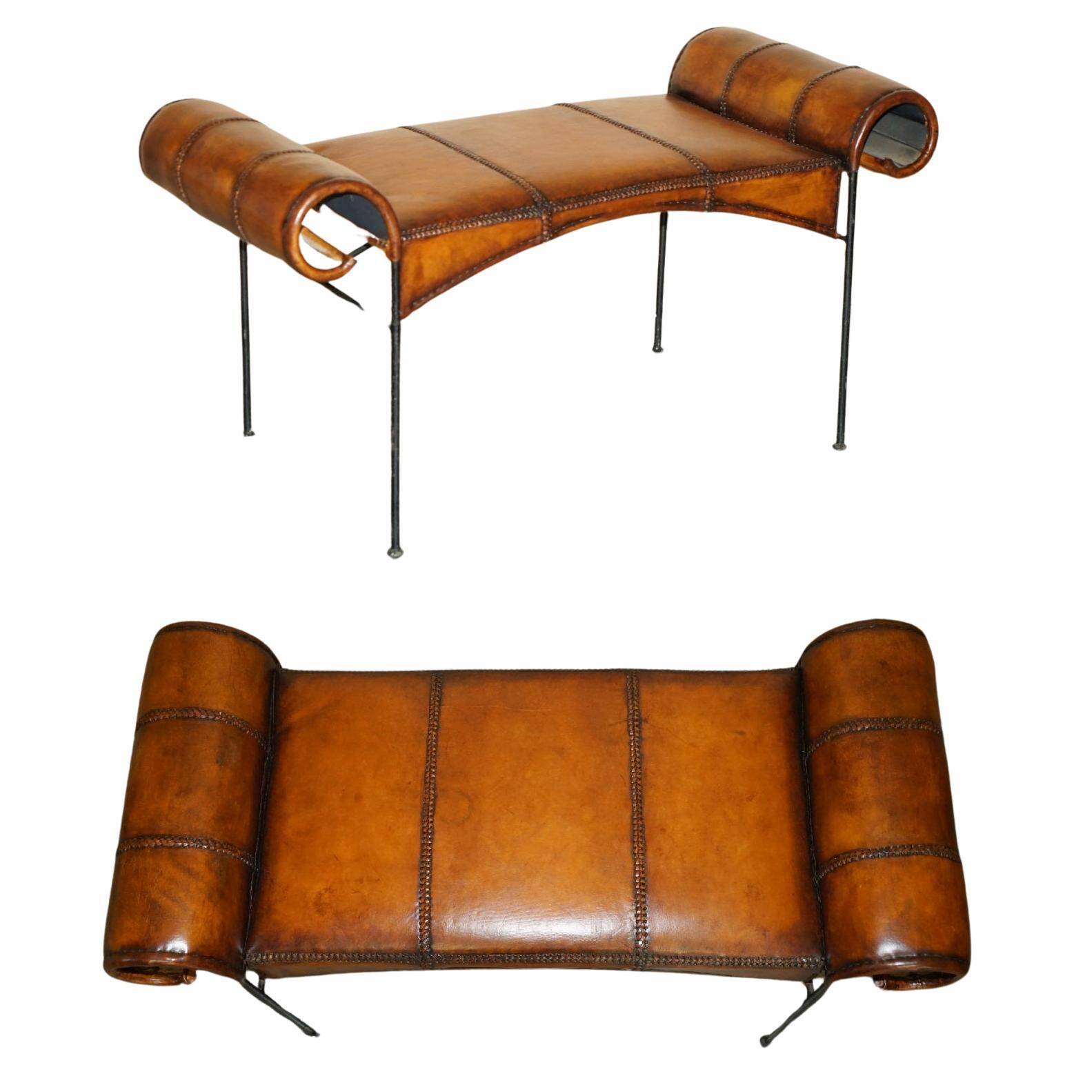 Vintage Spanish window bench in hand-stitched leather and restored iron.