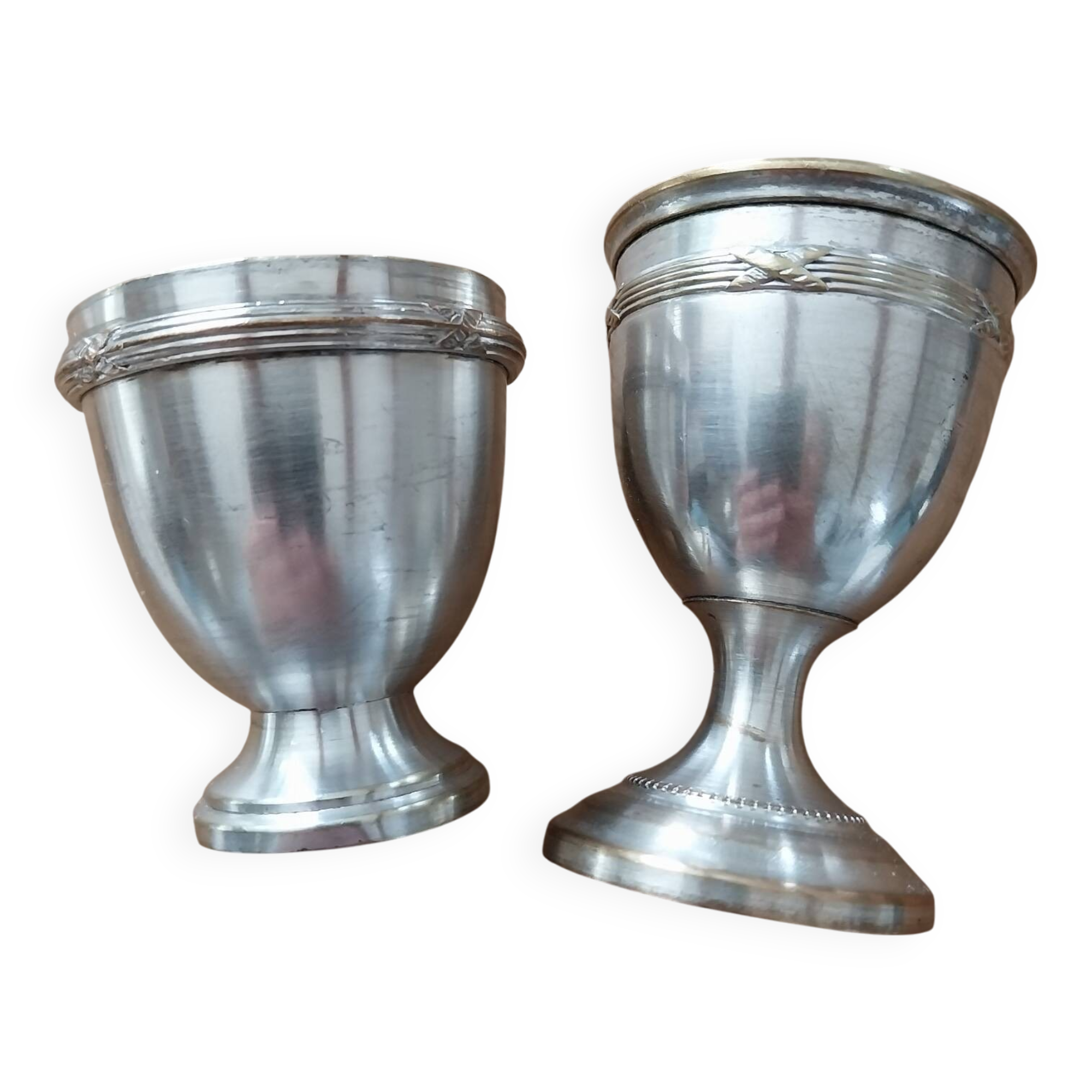Antique egg cups on silver-plated metal stand