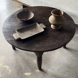 Coffee table, round antique Indonesian teak table with straight legs.