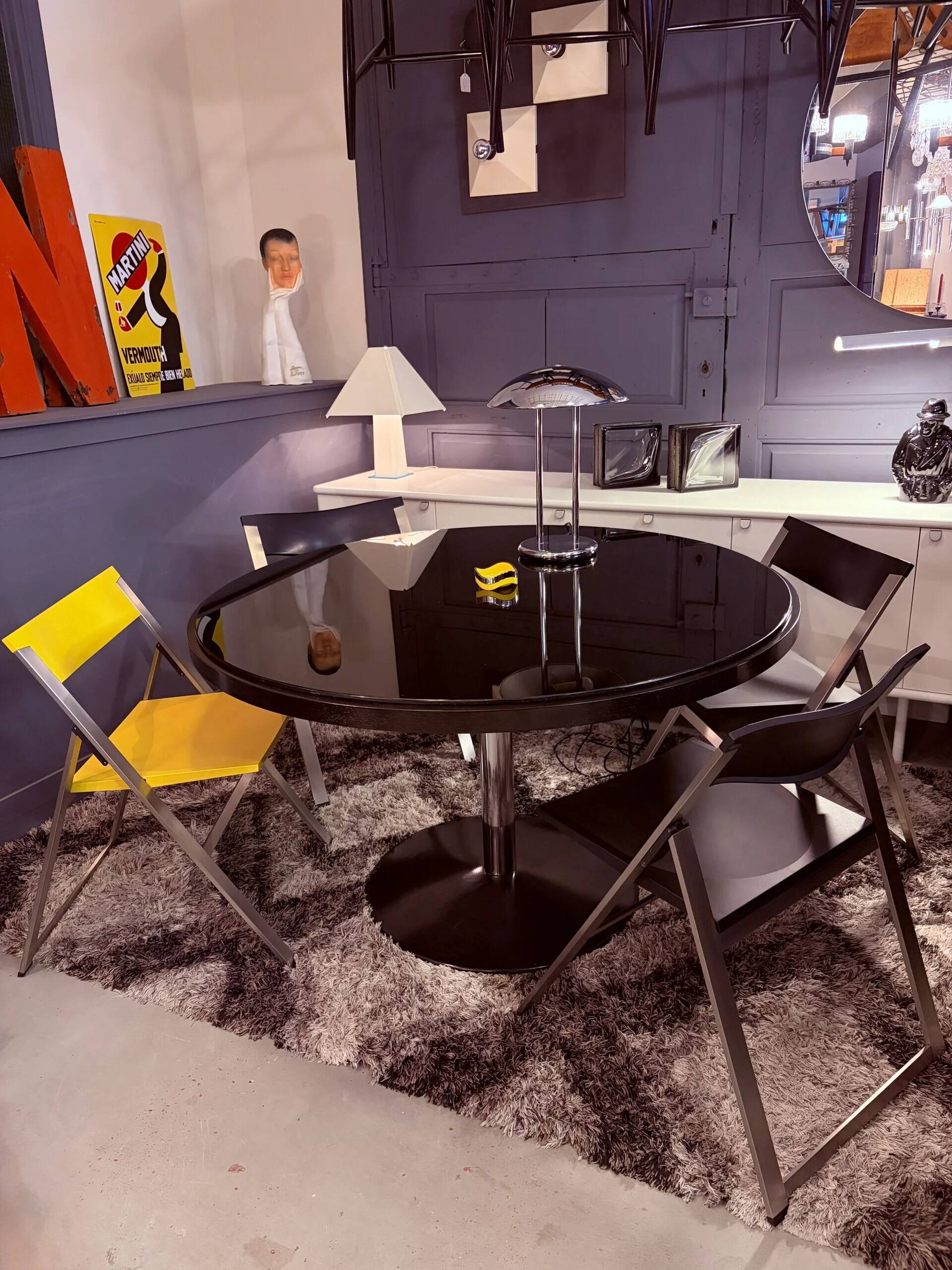 Round dining table, 1980s, black stained wood with glass top