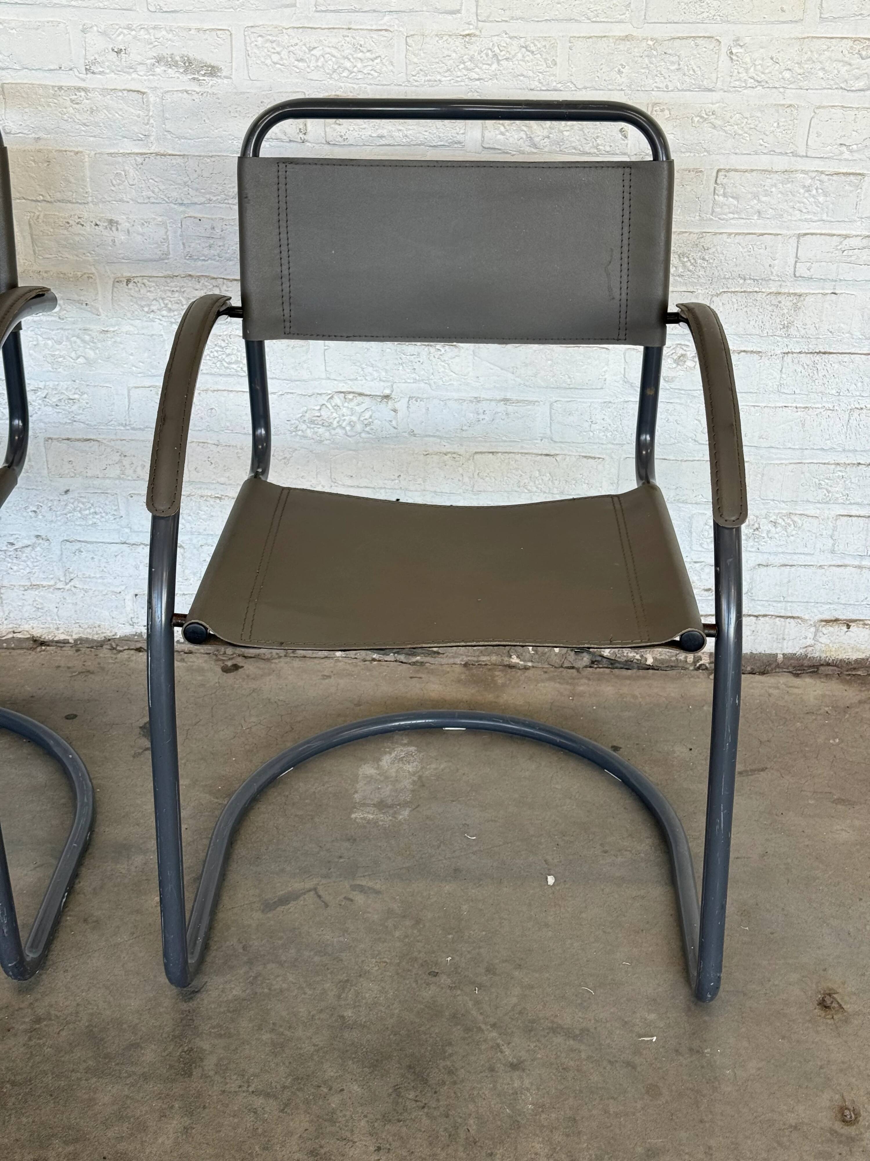 Vintage cantilever lounge chairs — pair, grey leather and tubular steel