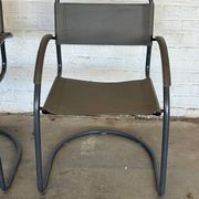 Vintage cantilever lounge chairs — pair, grey leather and tubular steel