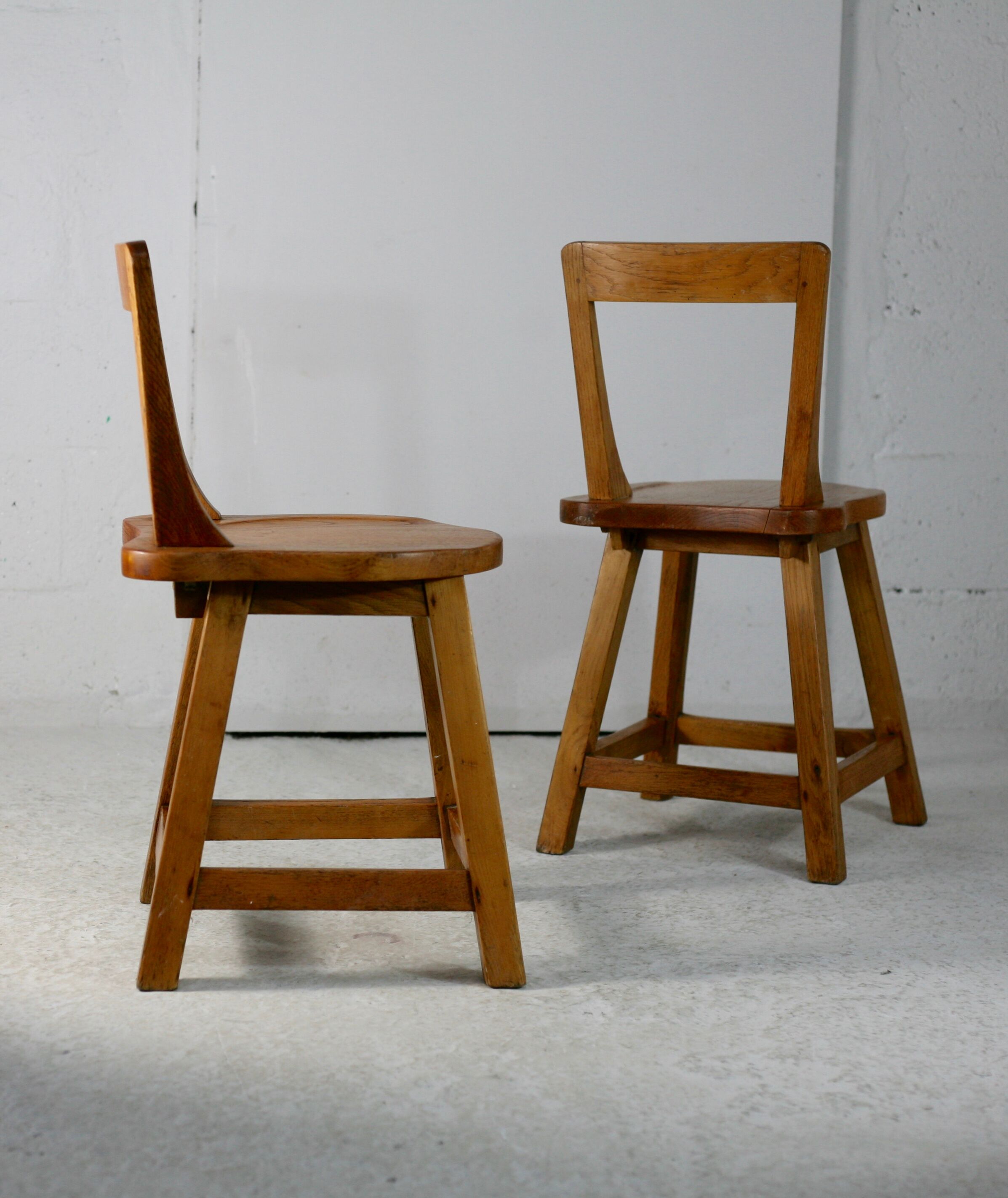 Pair of brutalist wooden back stools. France, circa 1960
