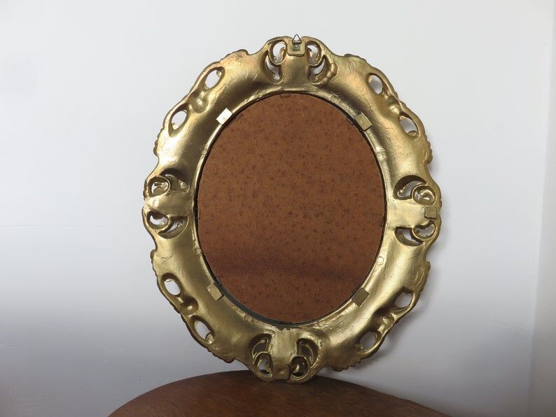 Golden baroque oval mirror, 60s-70s