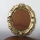 Golden baroque oval mirror, 60s-70s