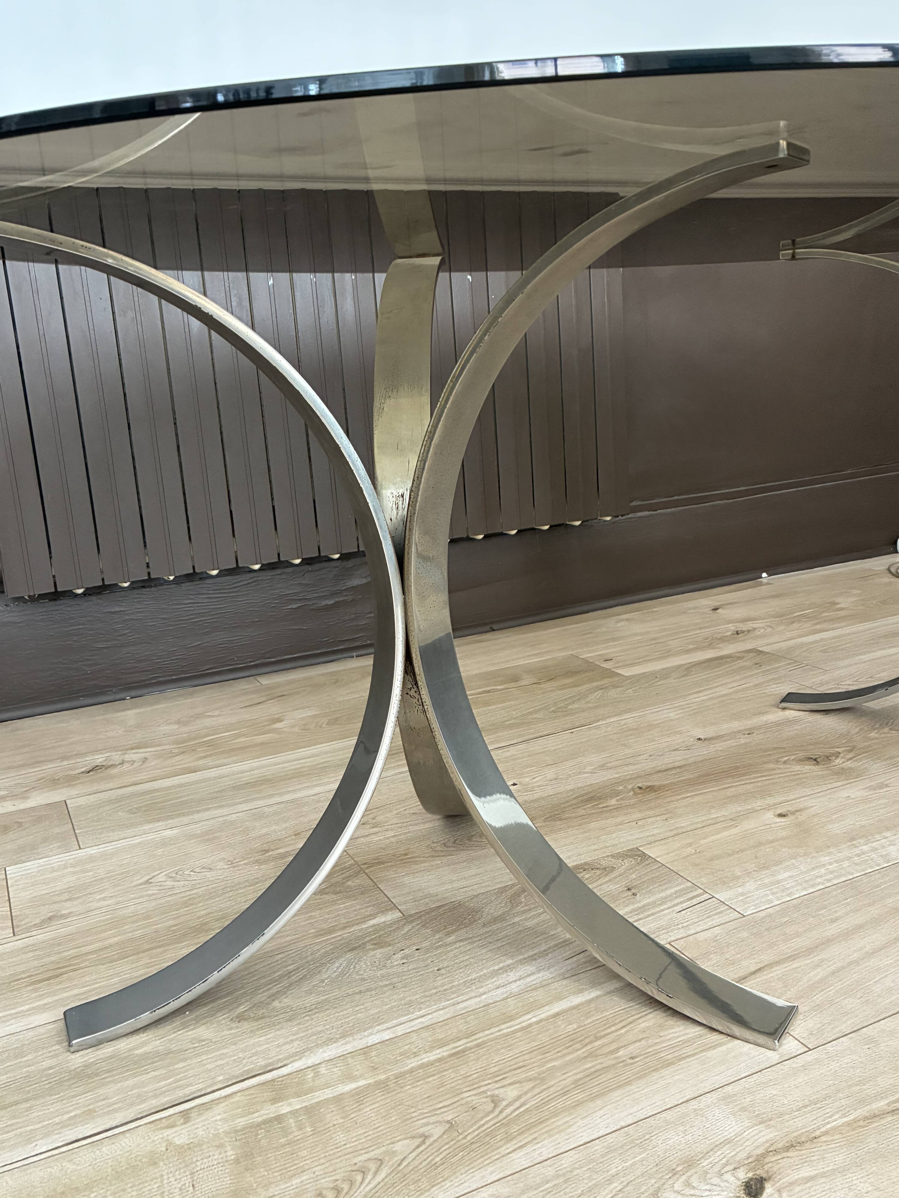 Smoked glass table with a metal base.