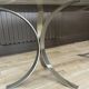 Smoked glass table with a metal base.