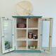 Green and beige 2-door wall display case