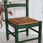 Vintage children's chair in green wood with a woven straw seat
