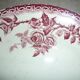 Beige earthenware plate with rose decoration and red garlands