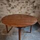 Antique round dining table in cherry wood, France, circa 1920.