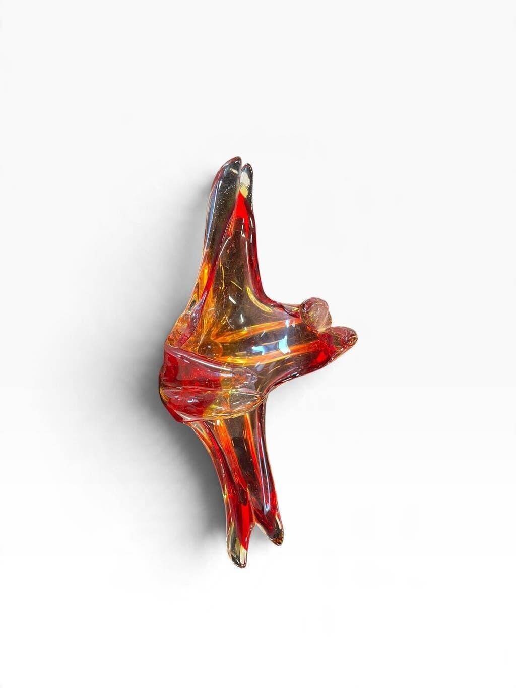 Vintage Murano glass bowl/plate in orange-red with swirling patterns.