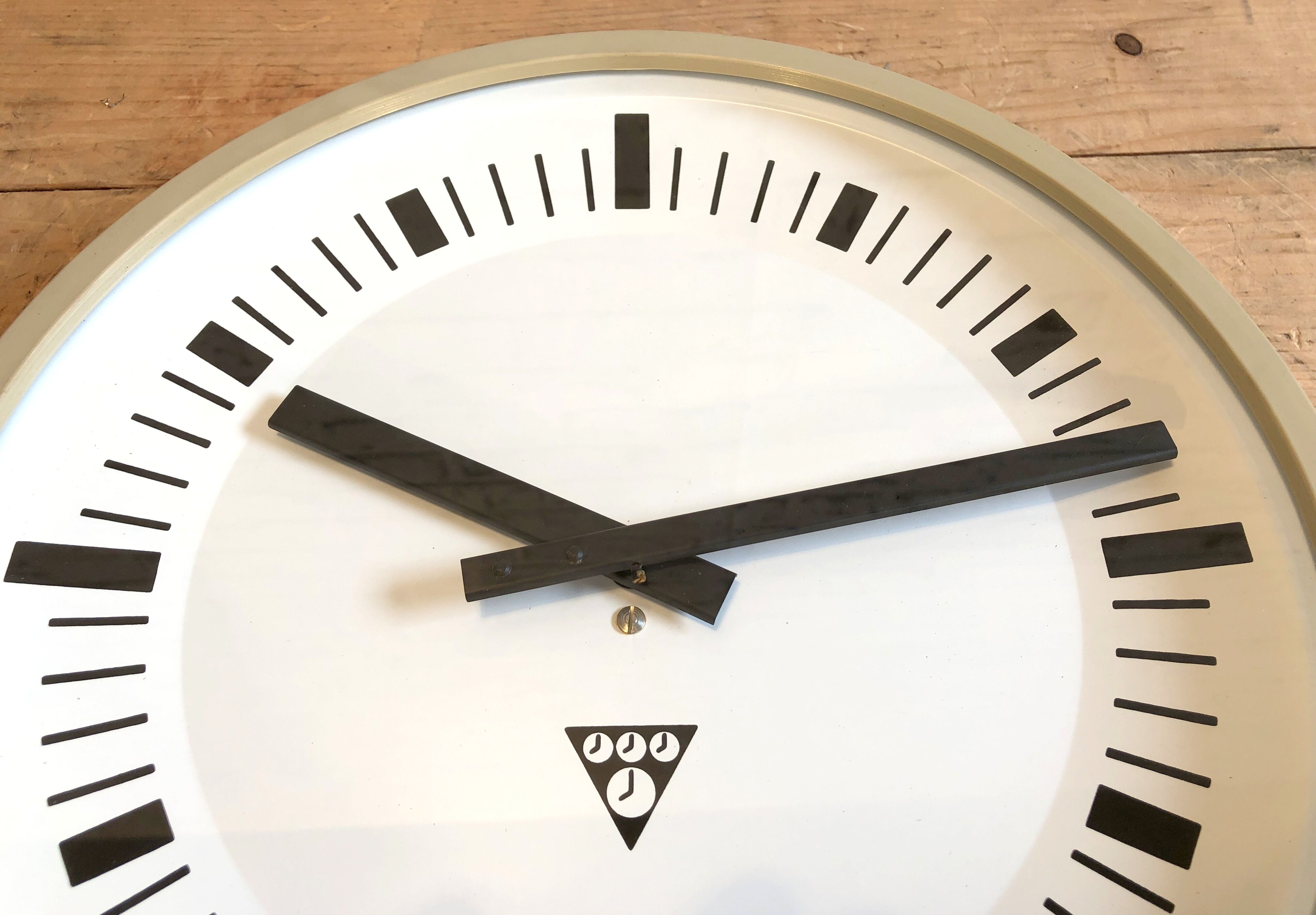 Beige industrial bakelite wall clock from Pragotron, 1970s