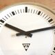 Beige industrial bakelite wall clock from Pragotron, 1970s