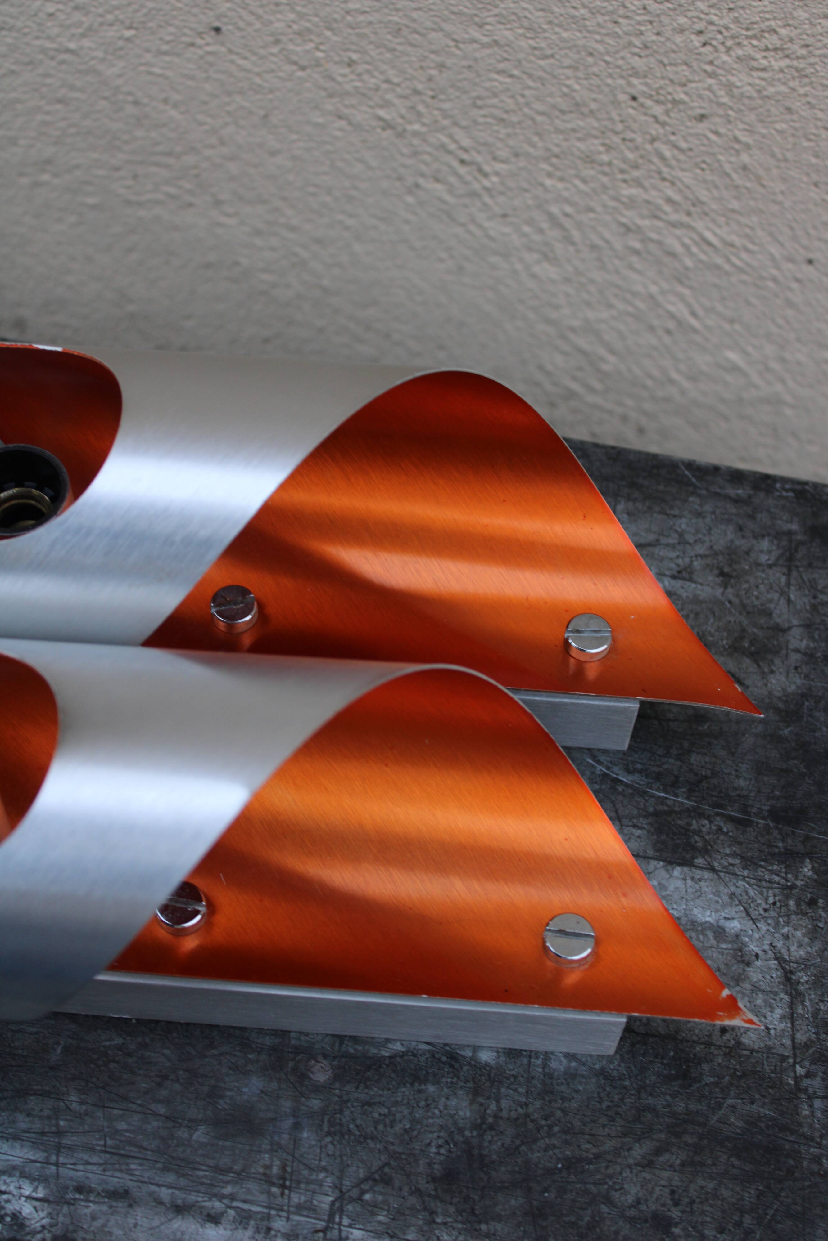 Pair of orange brushed aluminum wall light