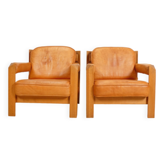 2 oak armchairs in cognac leather by Skilla