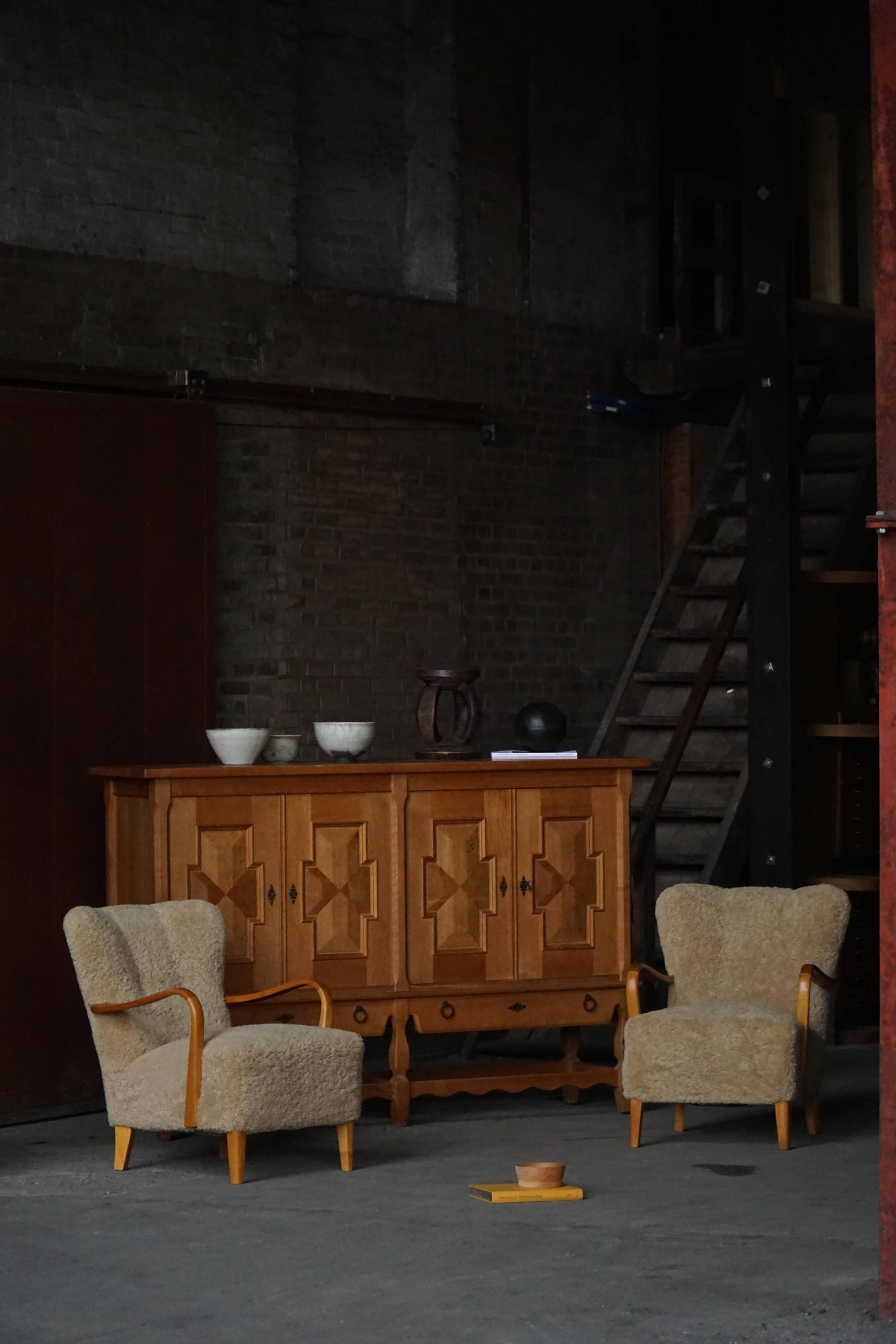 Pair of Mid Century Modern Swedish lounge chairs in birch and lamb's wool, 1960s.