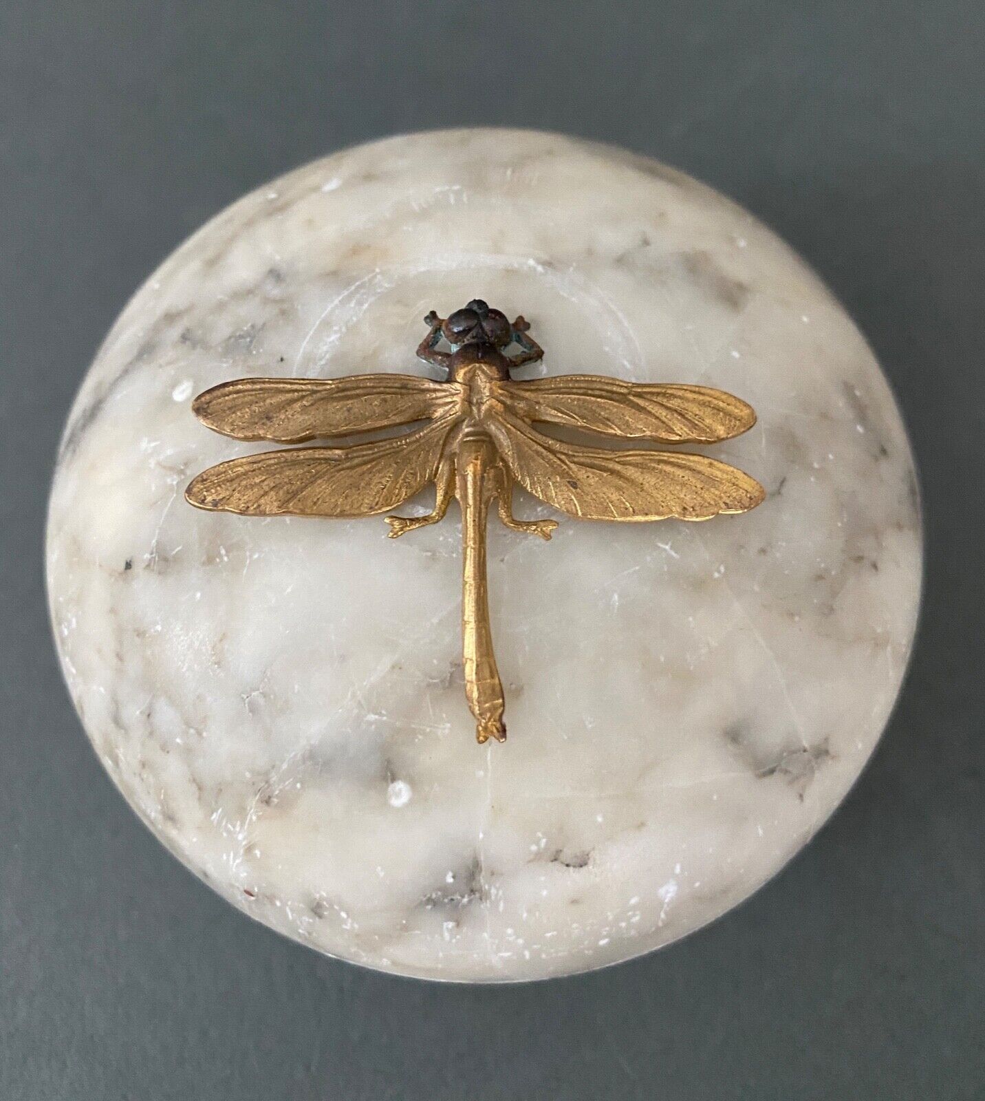 1900 alabaster ball shaped box surmounted by a golden dragonfly