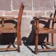 Pair of oak armchairs with straw seats and backs.