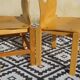 Pair of light wood chairs with post-formed seat and backrest.