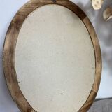Oval-shaped gilded wooden mirror