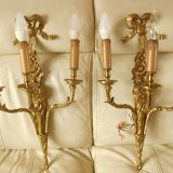 Pair of gilded bronze wall sconces with three lights