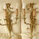Pair of gilded bronze wall sconces with three lights