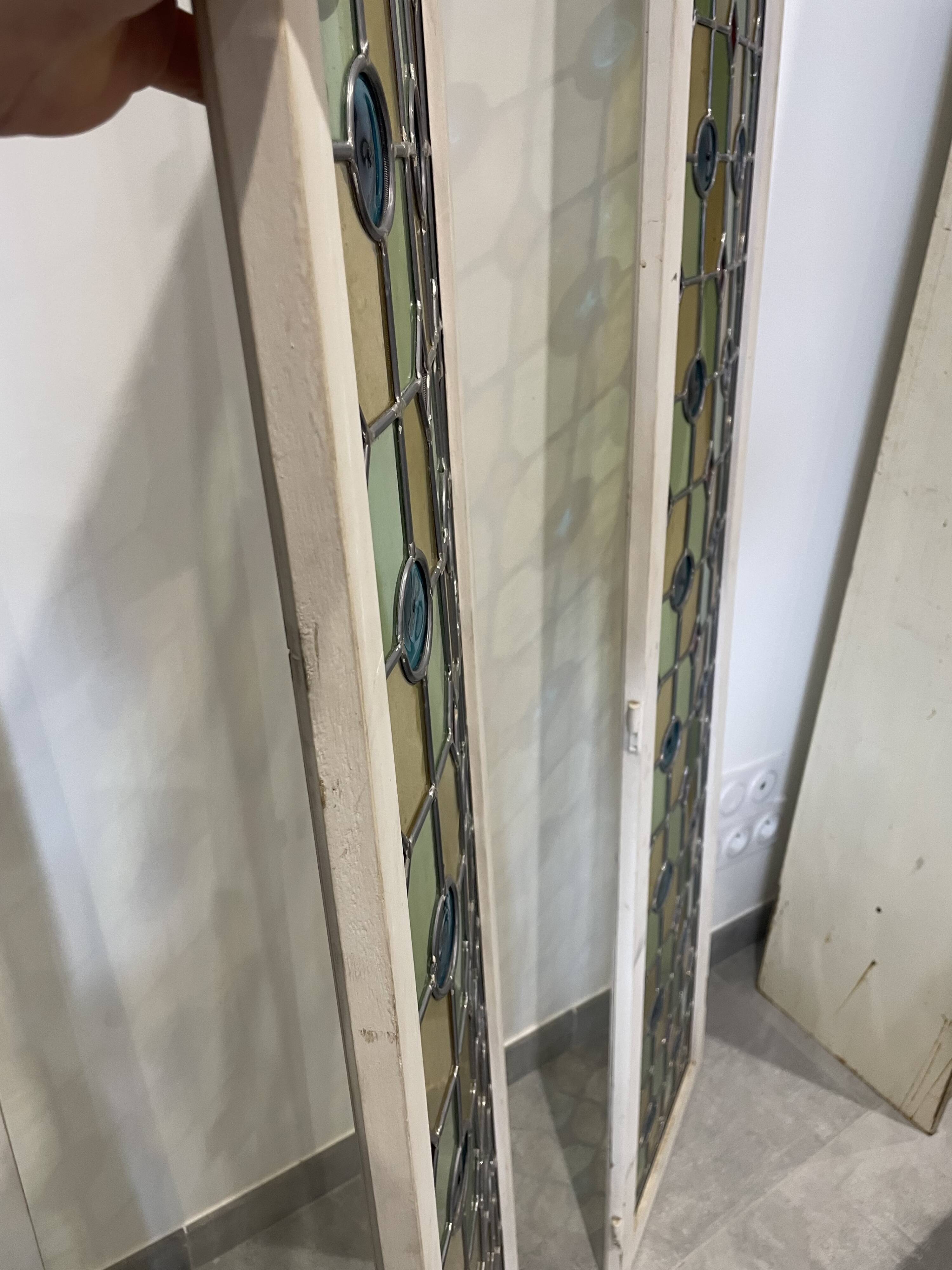 4 vintage faux stained glass panels that can form a screen or a partition