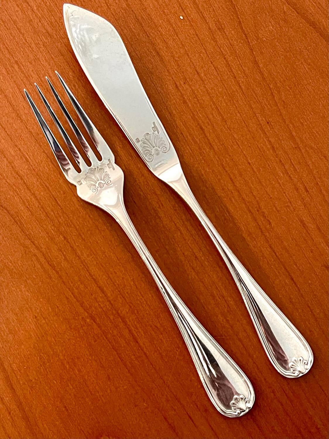 Christofle Marot Berain, 12 fish cutlery sets, shell decor