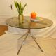 Table vintage 70 en verre légèrement fumé pieds chromés