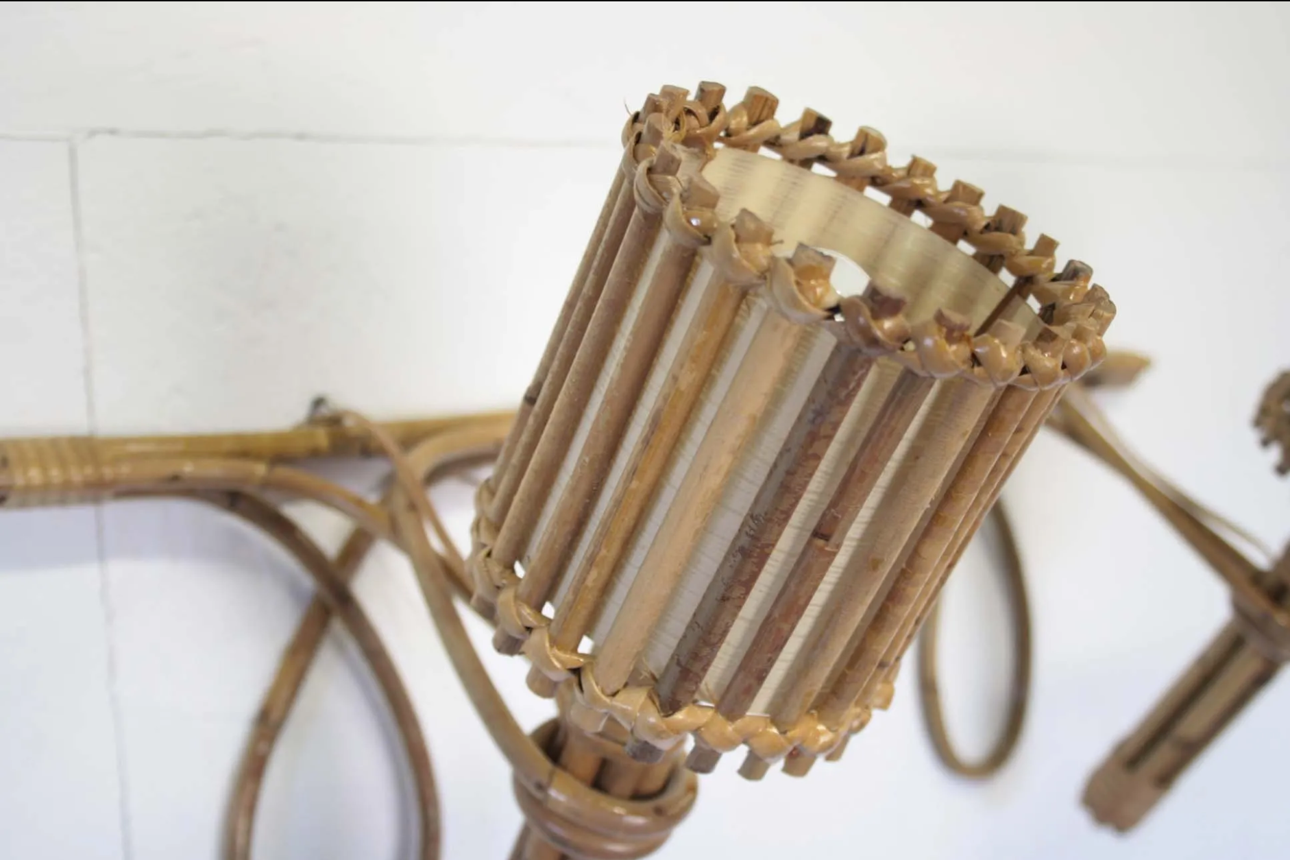 Pair of Louis Sognot rattan sconces