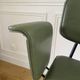 Vintage chair with green imitation leather armrests