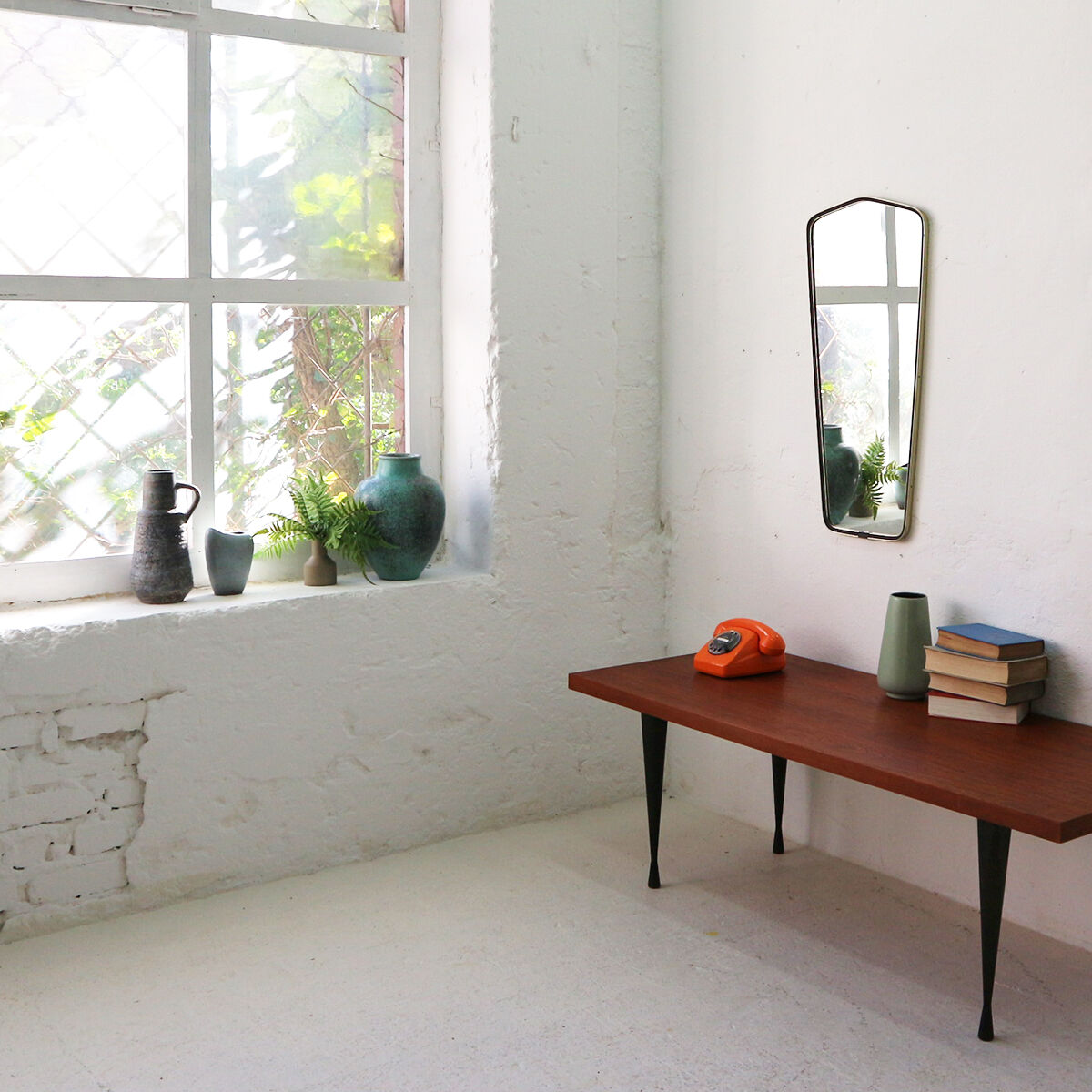 '50s wall mirror with relief brass frame