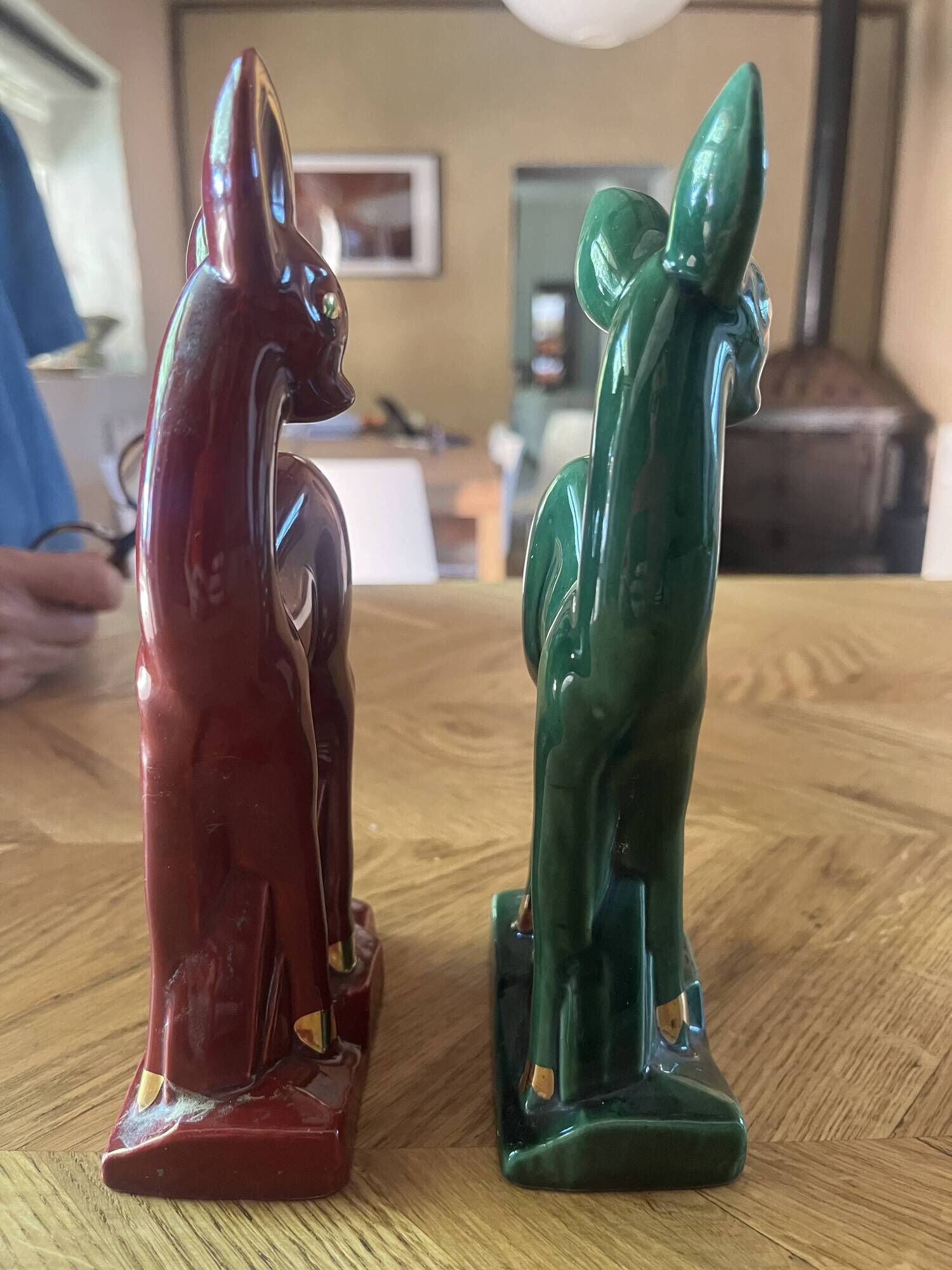 Pair of Art Deco deer by Charles Lemanceau in red and green ceramic.