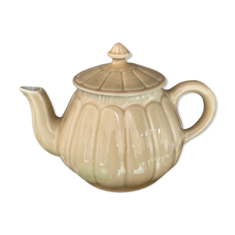 Beige earthenware teapot