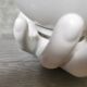 White ceramic hand wall lamp
