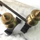 Old cast iron and brass bedside tables