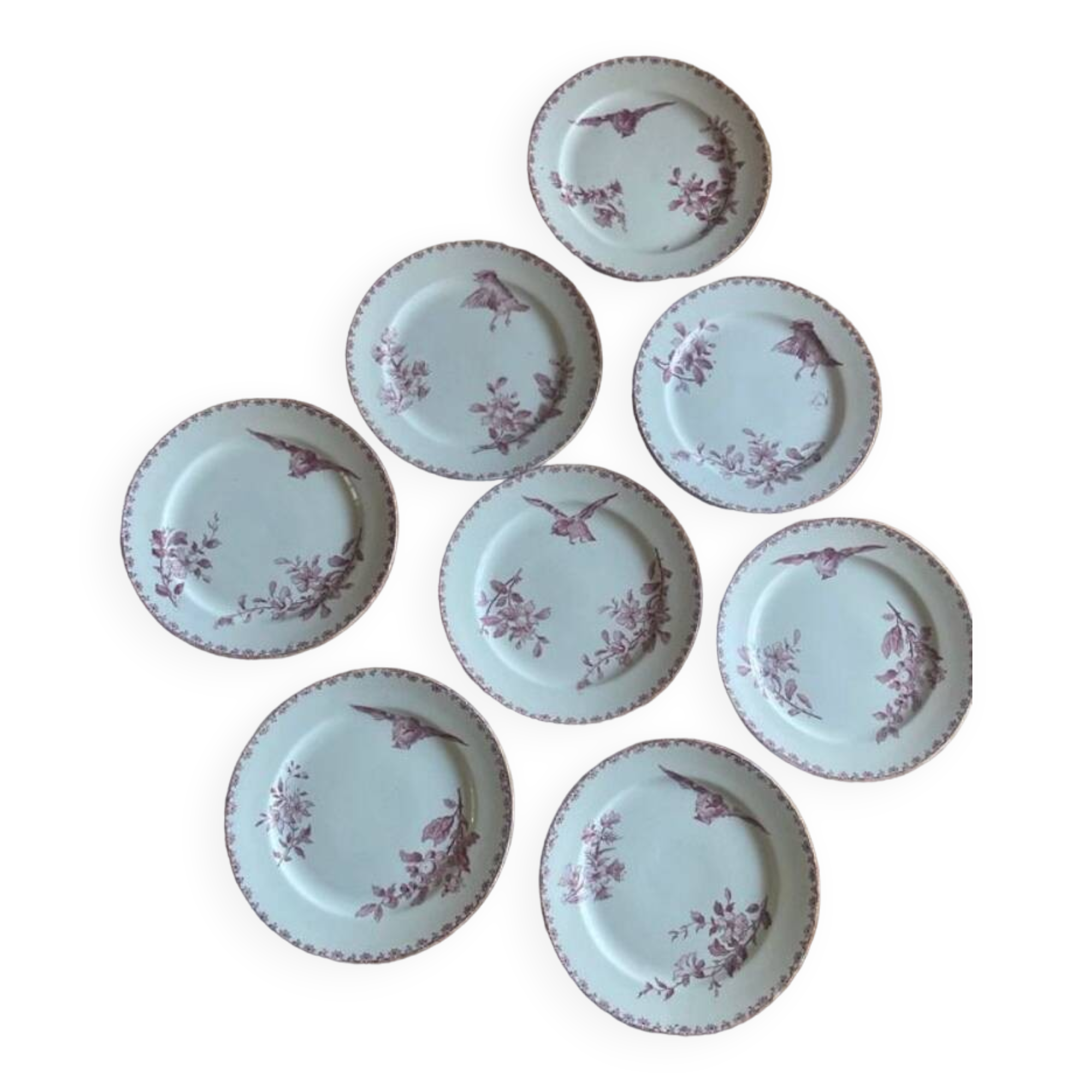 A series of eight flat plates in Terre de fer earthenware, Favori aux oiseaux model - pink tint