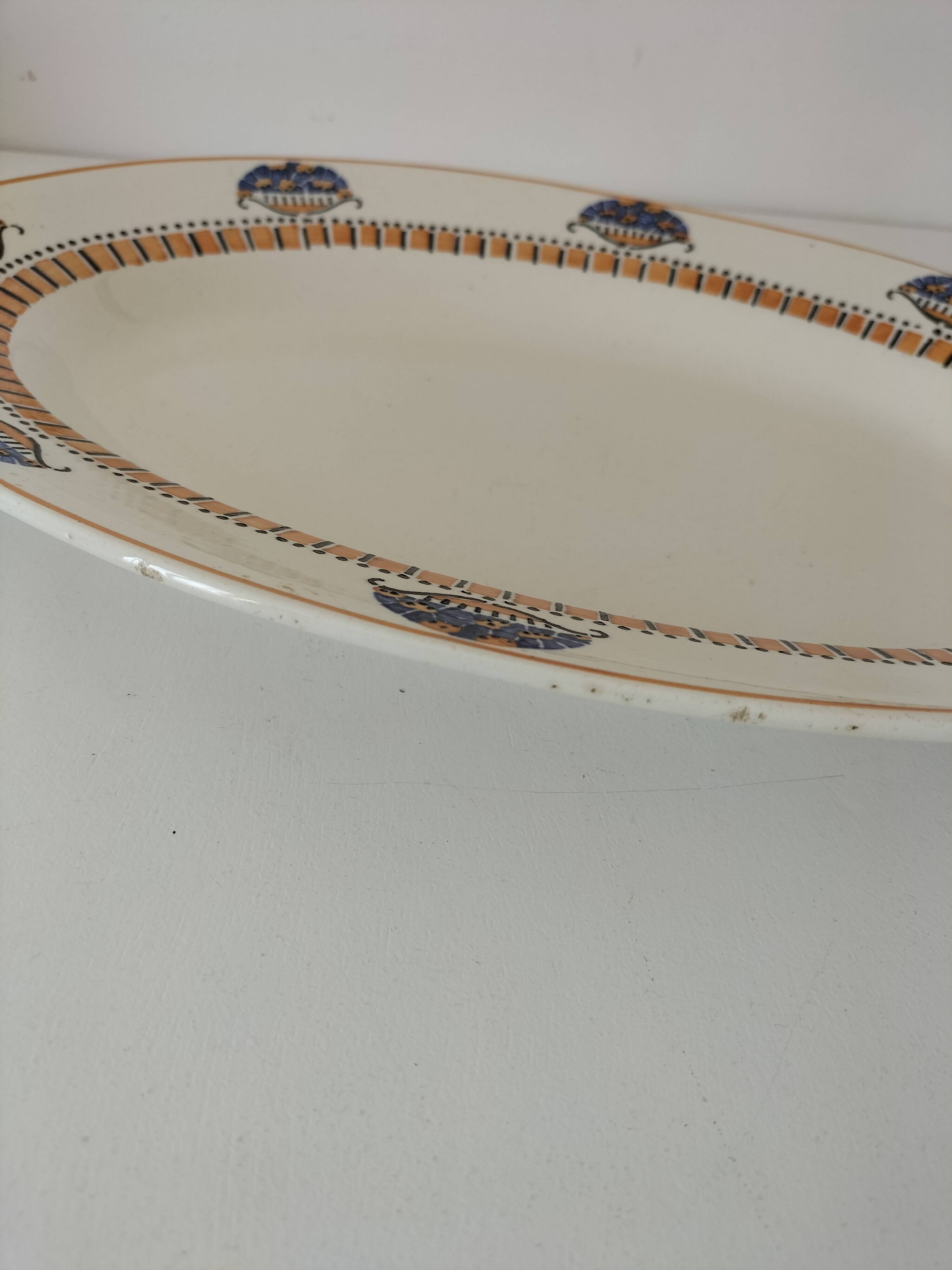 Oval Art Deco plate from Longwy pottery.