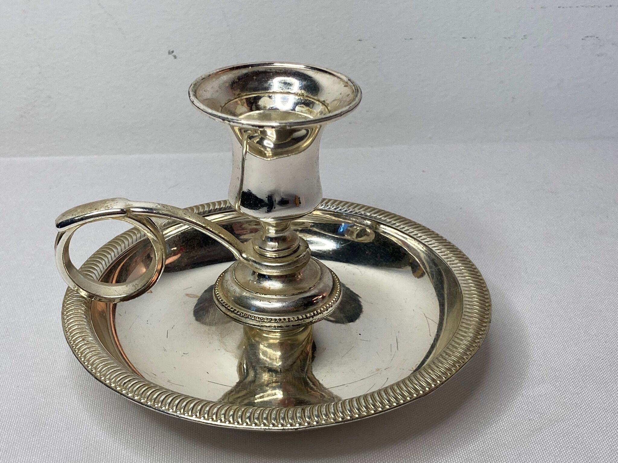 Twentieth century silver metal hand candle holder