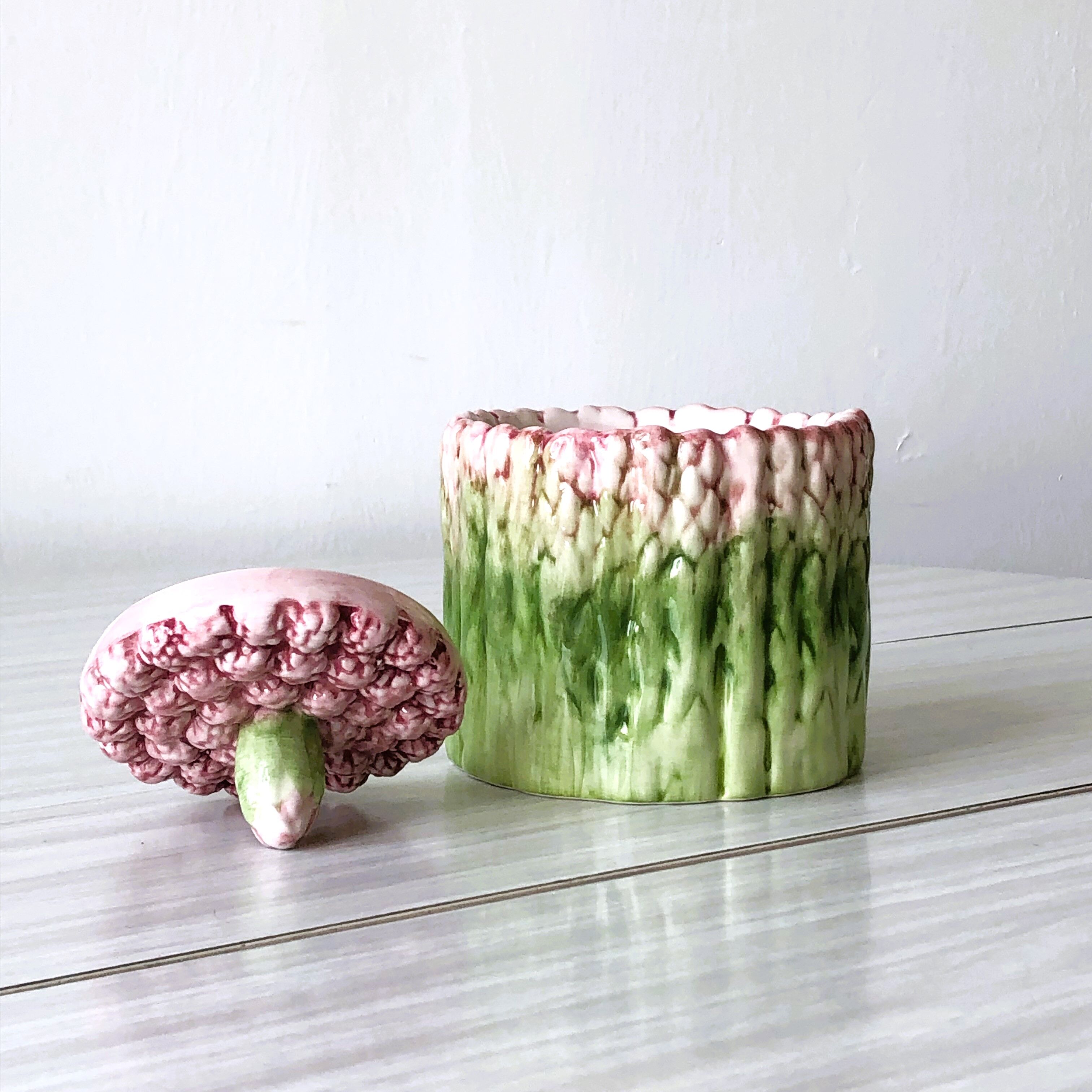 Old mustard pot and its slid in slurry decoration bunch of asparagus.